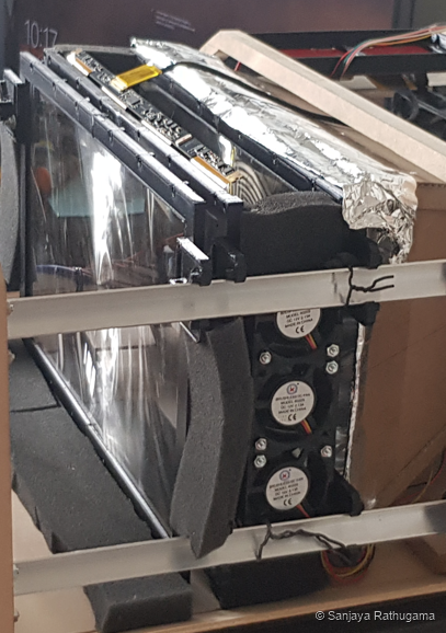Small cooling fans mounted beside the projector LCD